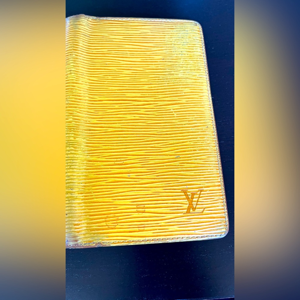 Louis Vuitton Epi Leather Wallet. LV Monogram on front.
